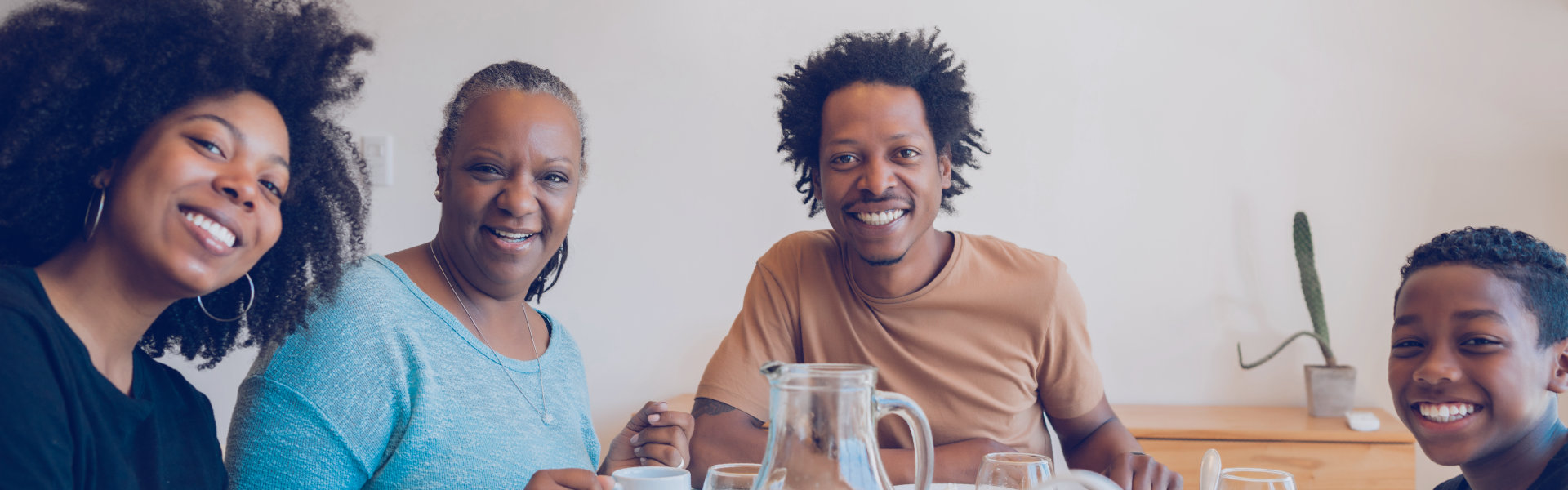 Family having breakfast together at home.